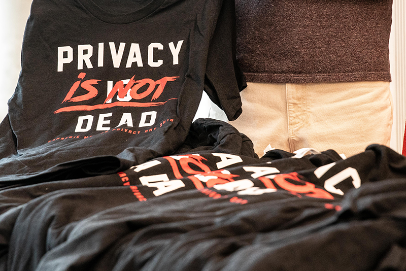 privacy day tshirts black and red on table